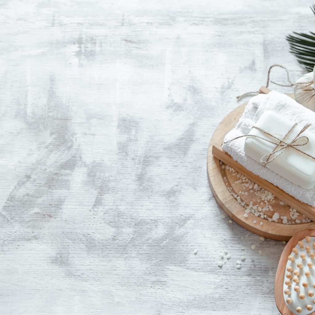 Spa composition with body care items on a light background . A place for text, a concept of beauty and body care .